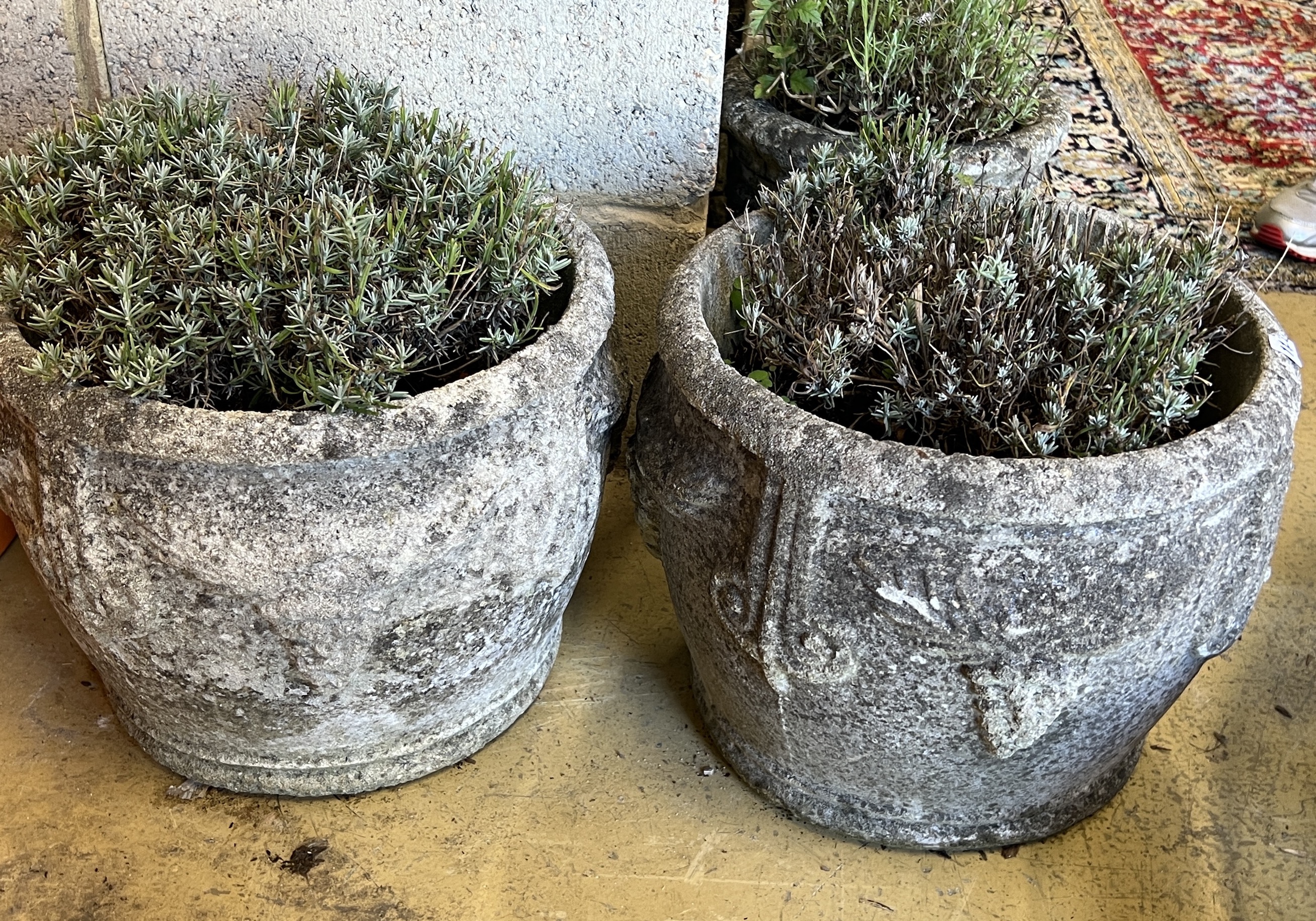 A pair of circular reconstituted stone garden planters, diameter 38cm, height 30cm